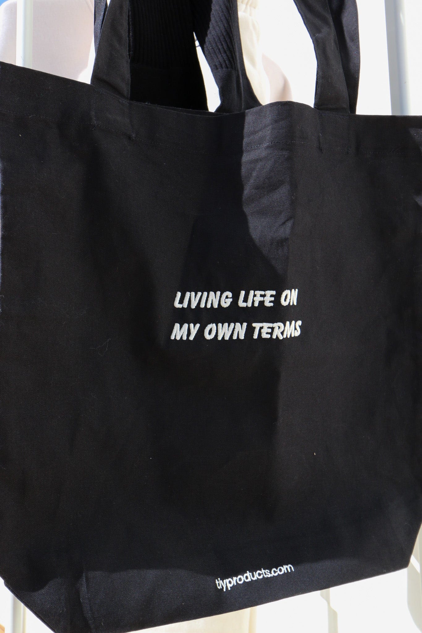 Tote in black: "Living life on my own terms".