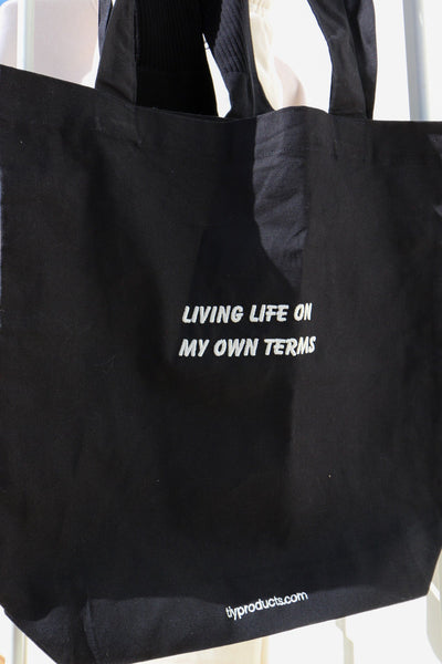 Tote in black: "Living life on my own terms".