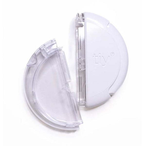 A white and clear plastic circular container split into two halves, with one side labeled tiy, displayed on a white background.