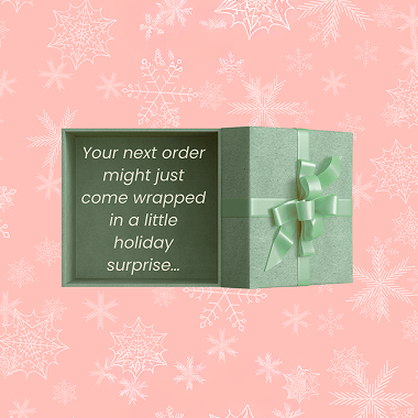 Snowflakes and green package for day 2 of christmas promos